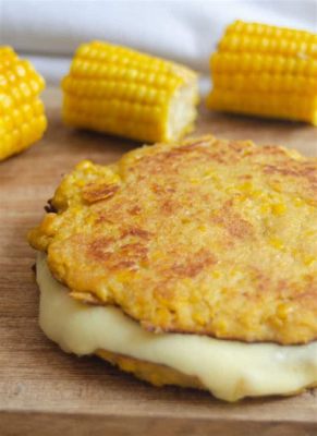  Arepas de Queso: Experience the Creamy Delight of Melted Cheese Tucked Inside Crispy Corn Cakes!